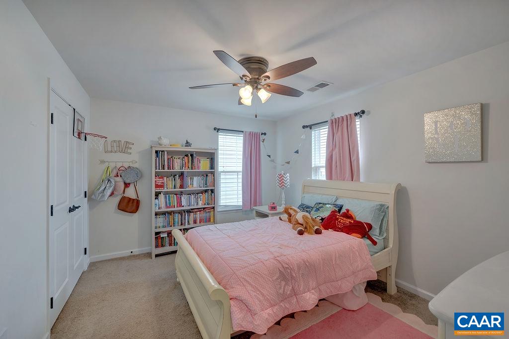 2346 Jersey Pine Ridge Charlottesville, VA 22911 - Photo 24 of 45 a bed room with a bed and a book shelf