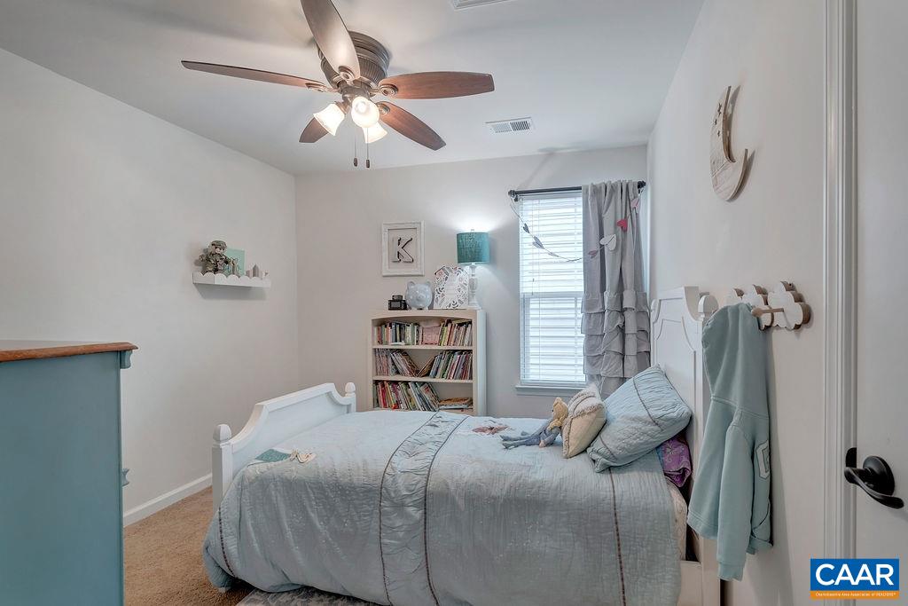 2346 Jersey Pine Ridge Charlottesville, VA 22911 - Photo 25 of 45 a bedroom with a bed and a chandelier