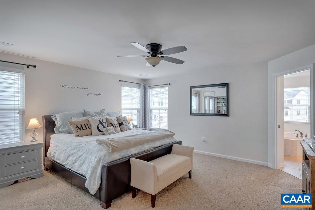 2346 Jersey Pine Ridge Charlottesville, VA 22911 - Photo 28 of 45 a bedroom with a bed and a ceiling fan