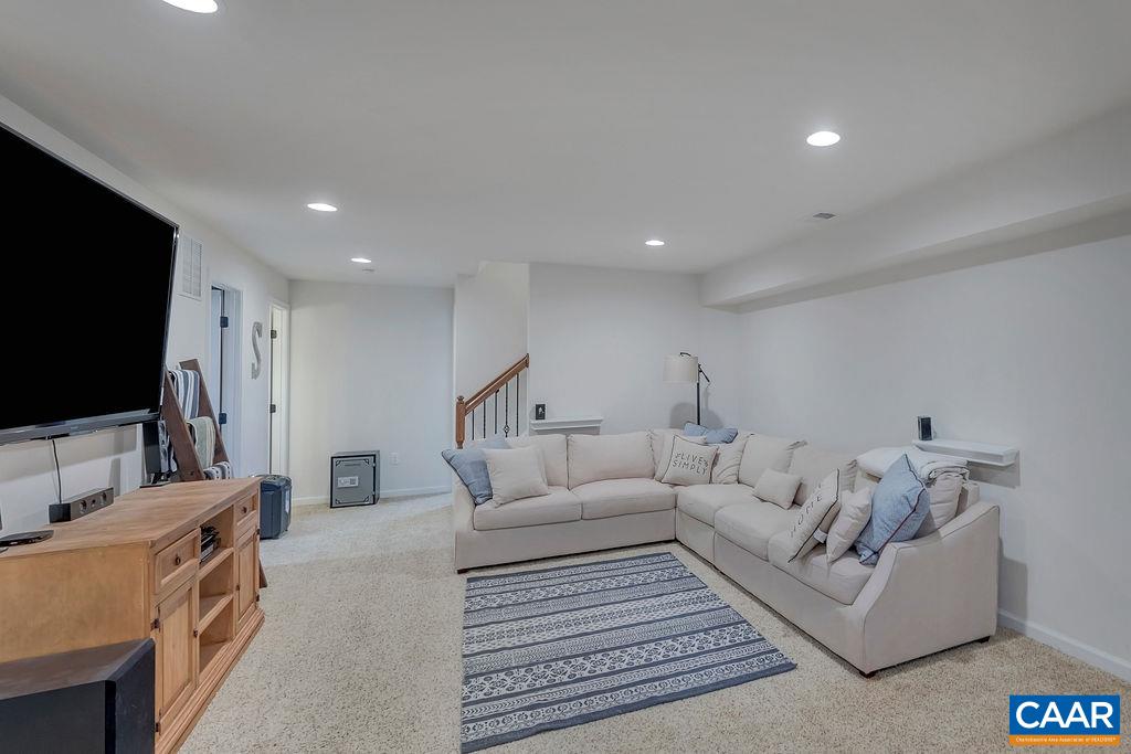 2346 Jersey Pine Ridge Charlottesville, VA 22911 - Photo 36 of 45 a living room with furniture and a flat screen tv