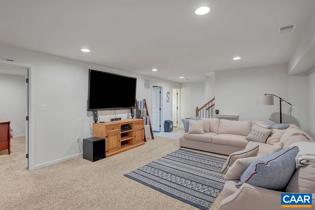 2346 Jersey Pine Ridge Charlottesville, VA 22911 - Photo 37 of 45 a living room with furniture and a flat screen tv