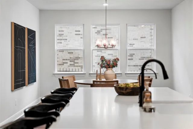 a kitchen with sink refrigerator and window