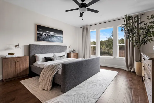 a bedroom with a large bed and a window