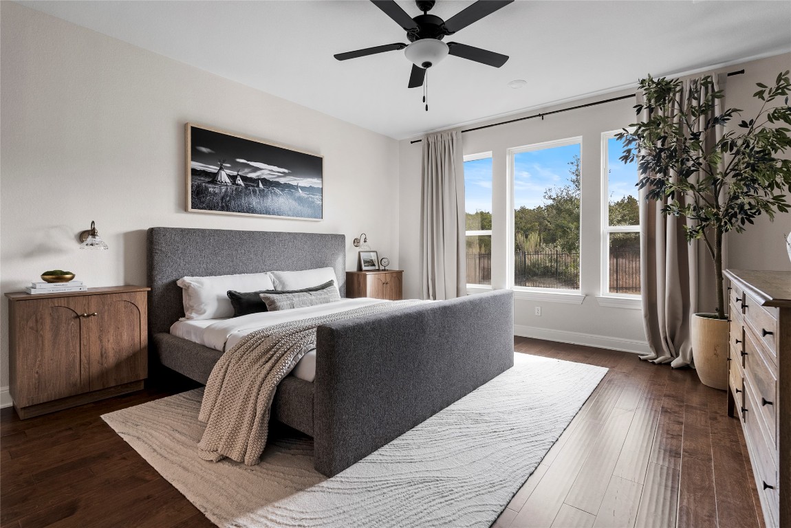 177 Running Bird Road Austin, TX 78737 - Photo 19 of 40 a bedroom with a large bed and a window