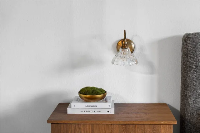 a table with a vase and flowers on it