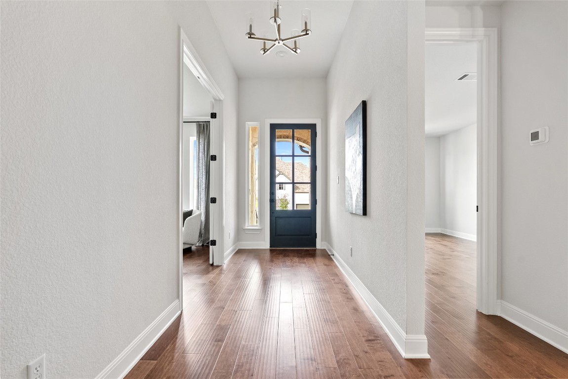 177 Running Bird Road Austin, TX 78737 - Photo 28 of 40 wooden floor in an empty room with a window