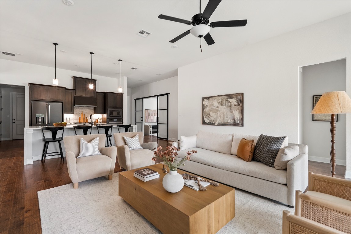 177 Running Bird Road Austin, TX 78737 - Photo 3 of 40 a living room with furniture and a wooden floor