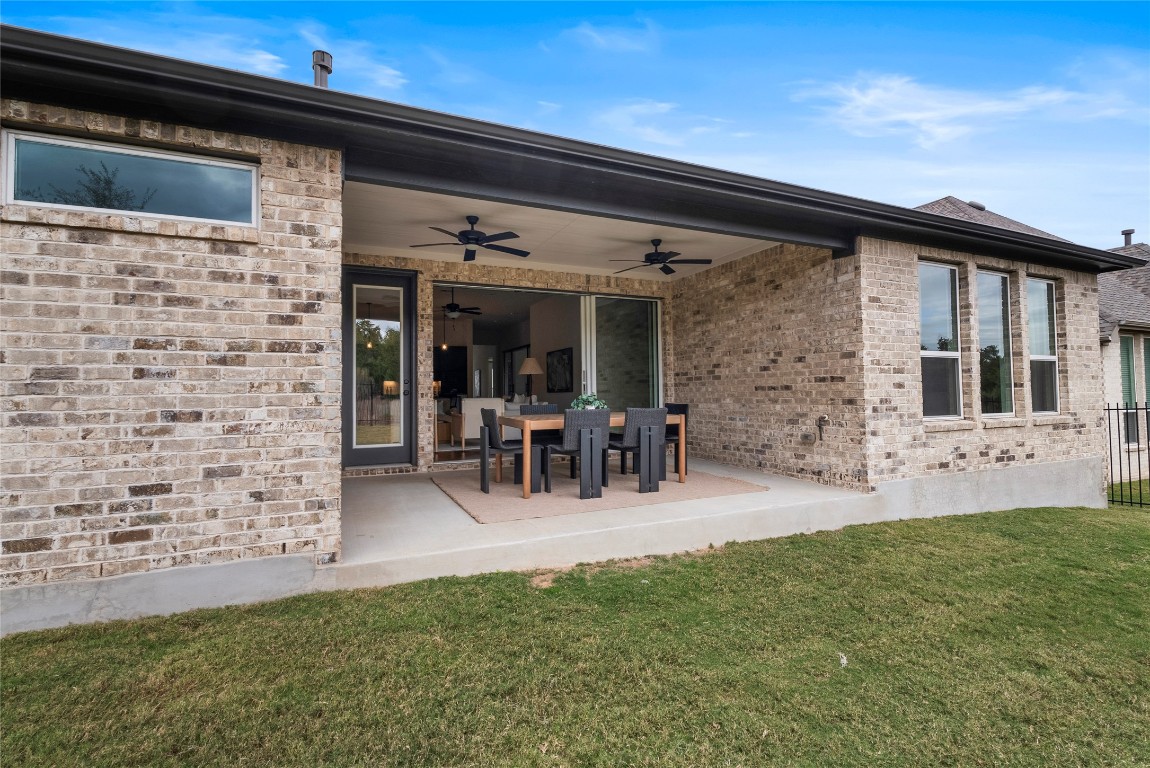 177 Running Bird Road Austin, TX 78737 - Photo 37 of 40 a view of a porch with chairs and backyard