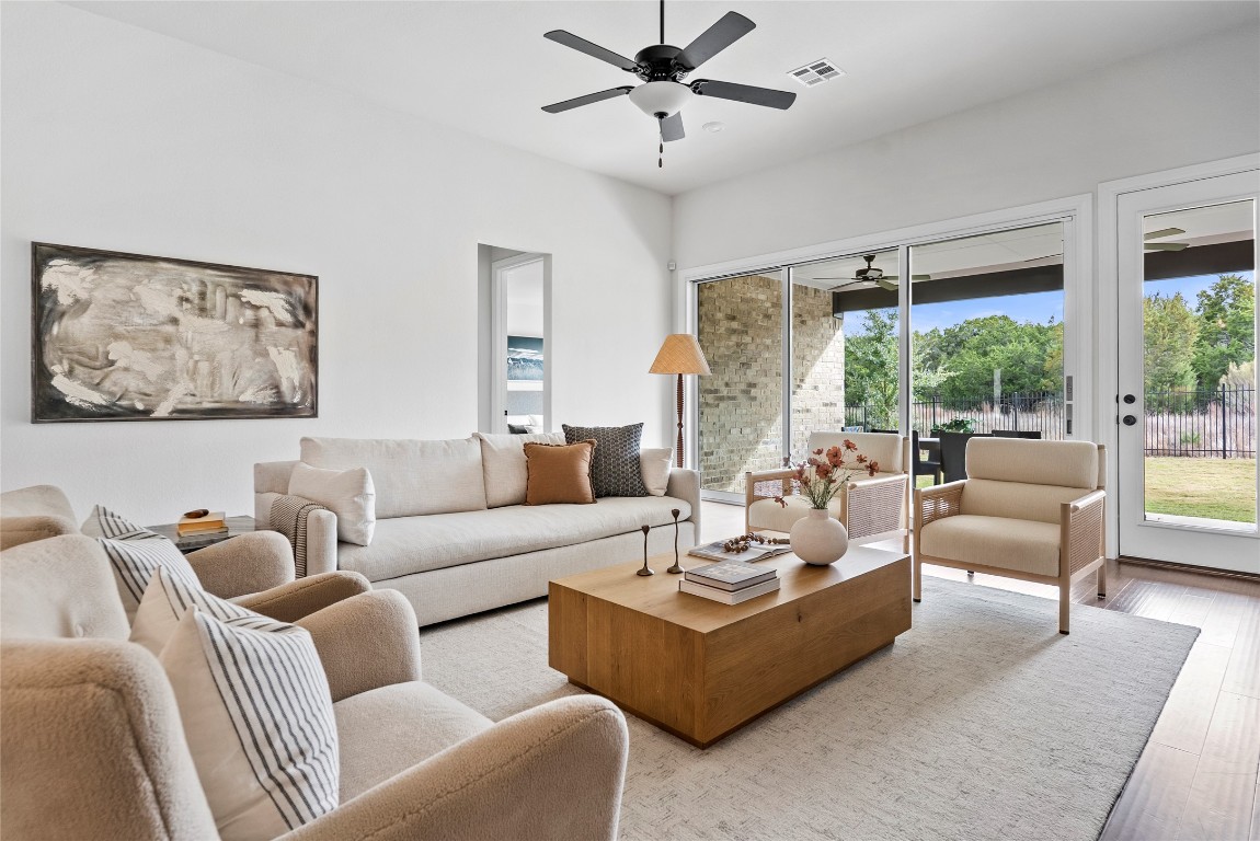 177 Running Bird Road Austin, TX 78737 - Photo 4 of 40 a living room with furniture and a large window