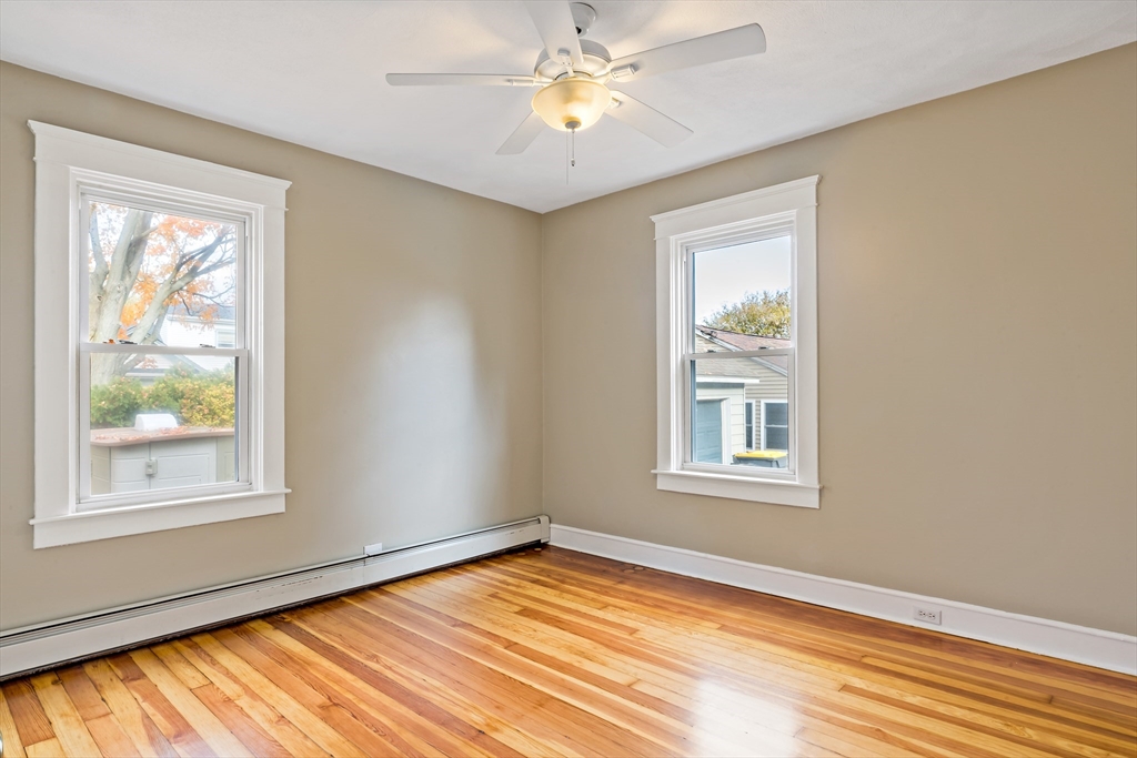 1000 Riverside Avenue Somerset, MA 02726 - Photo 13 of 26 a view of an empty room with window and wooden floor