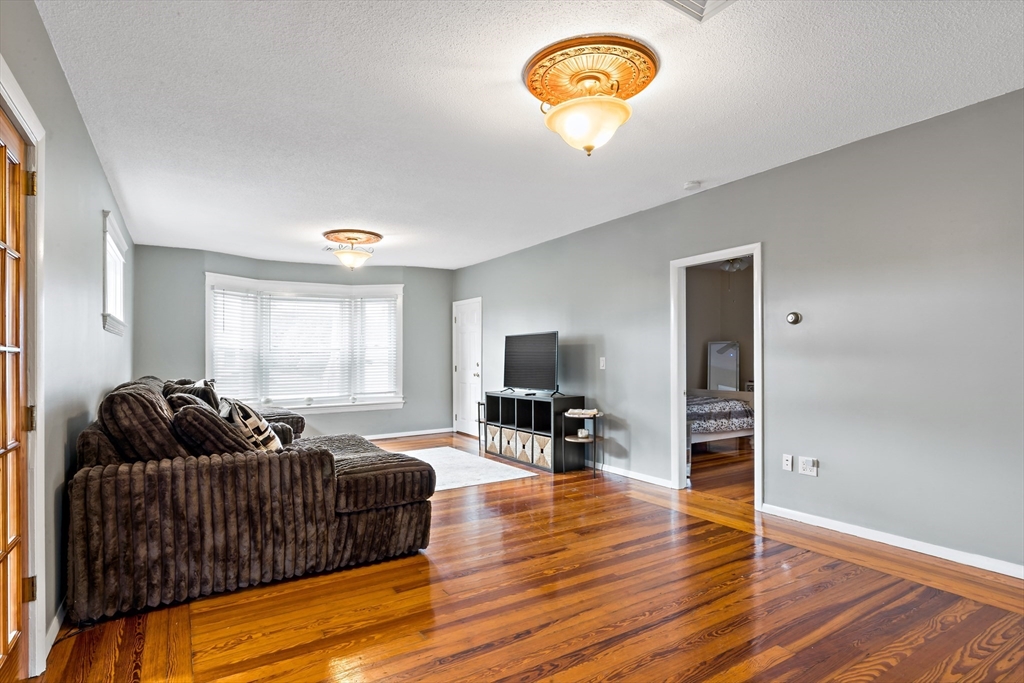 1000 Riverside Avenue Somerset, MA 02726 - Photo 15 of 26 a living room with furniture and a flat screen tv