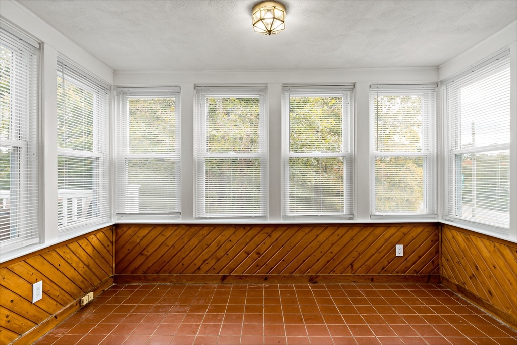 1000 Riverside Avenue Somerset, MA 02726 - Photo 18 of 26 a bed sitting in a bedroom next to a window