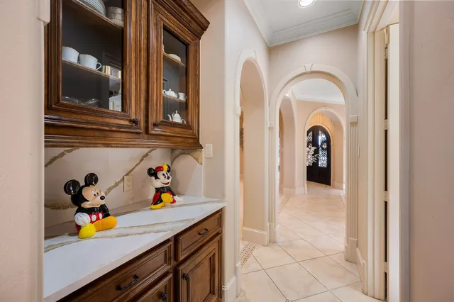 a kitchen with a refrigerator and cabinets