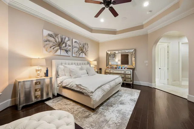 a large bathroom with a large tub and sink