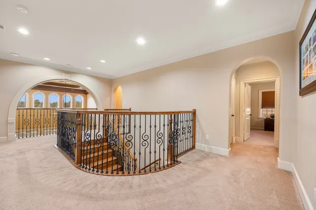 a bathroom with a granite countertop sink a toilet and a mirror