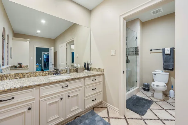 a bedroom with a bed a desk and chair