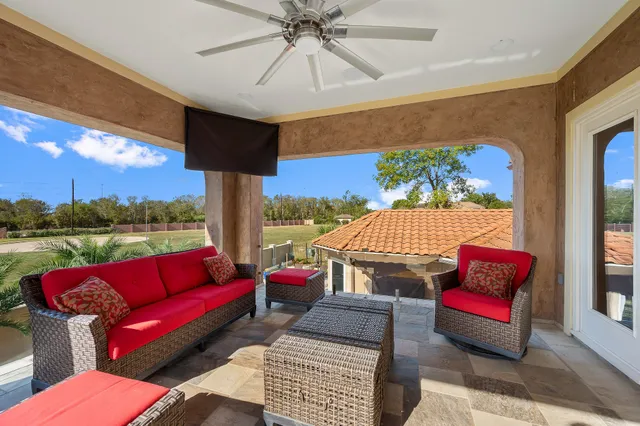 a swimming pool with outdoor seating