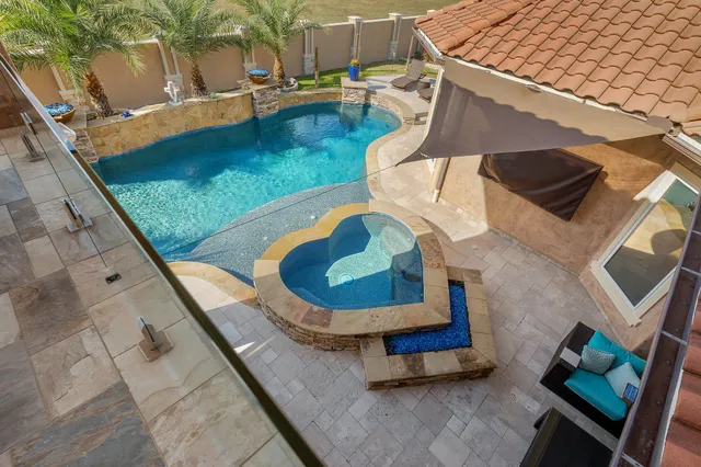 a view of a dining room with furniture a chandelier and wooden floor