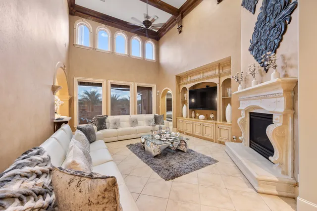 a living room with furniture fireplace and flat screen tv