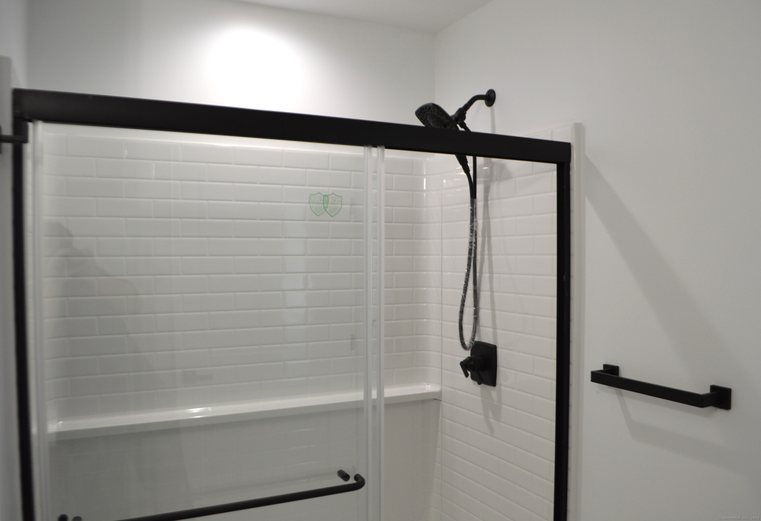 25 Church Street, Unit 106 New Milford, CT 06776 - Photo 6 of 11 a bathroom with a shower