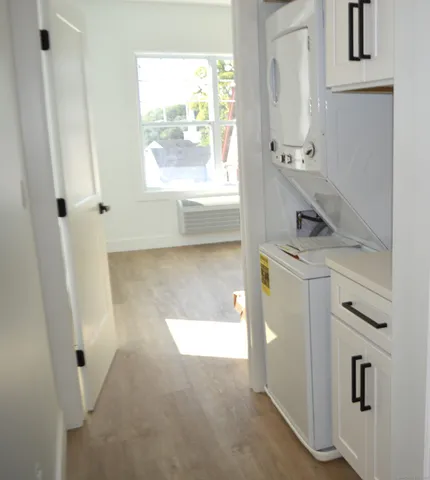 a utility room with closet dryer and washer