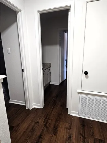 a view of front door with wooden floor