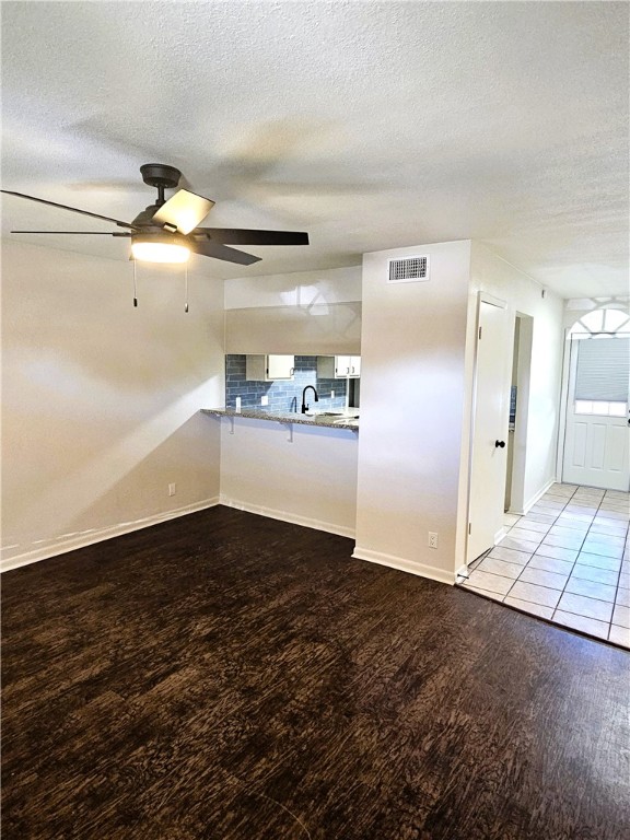 4816 Delwood Street, Unit 3 Corpus Christi, TX 78413 - Photo 2 of 19 a view of a refrigerator in kitchen and an empty room