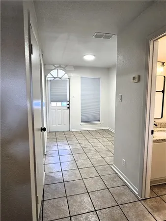 a view of a hallway with a kitchen