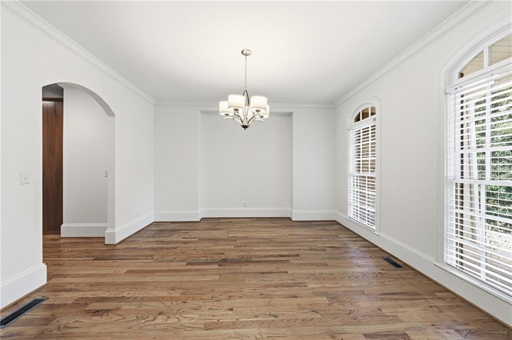 125 River N Circle Sandy Springs, GA 30328 - Photo 15 of 96 a view of a livingroom with wooden floor and a large window