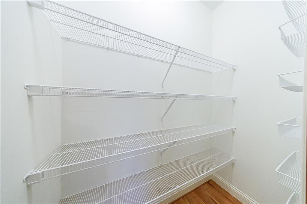 125 River N Circle Sandy Springs, GA 30328 - Photo 33 of 96 a view of walk in closet with empty racks
