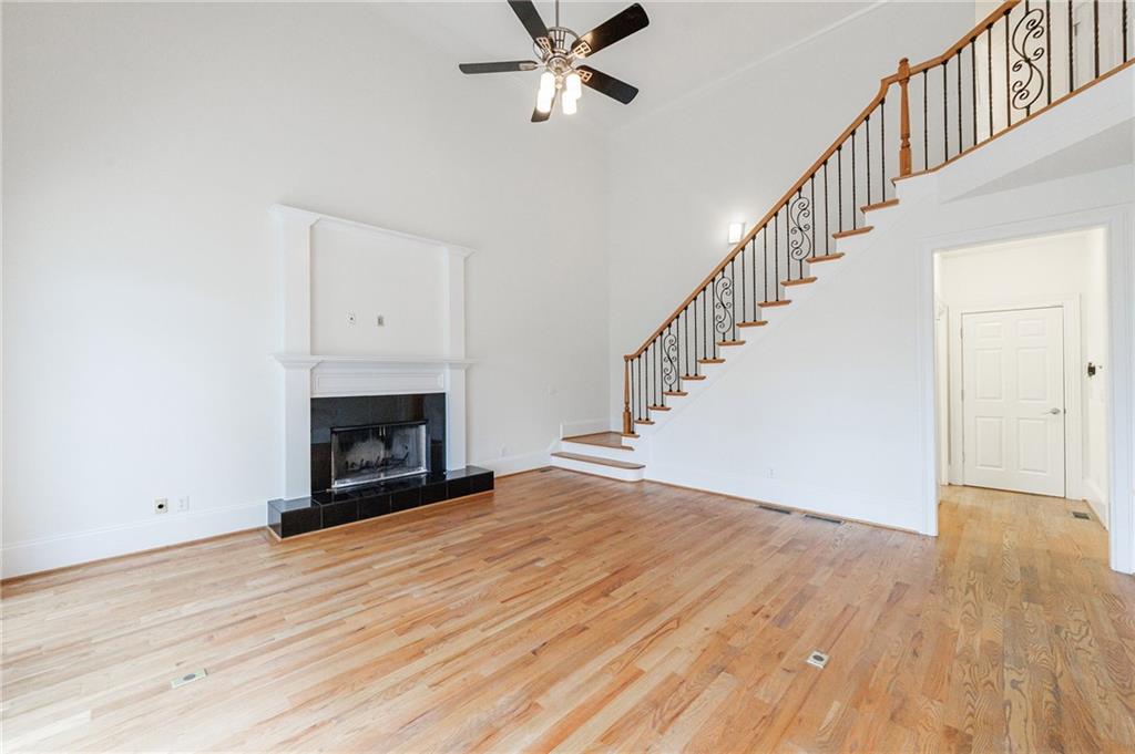 125 River N Circle Sandy Springs, GA 30328 - Photo 34 of 96 a view of empty room with wooden floor and fireplace
