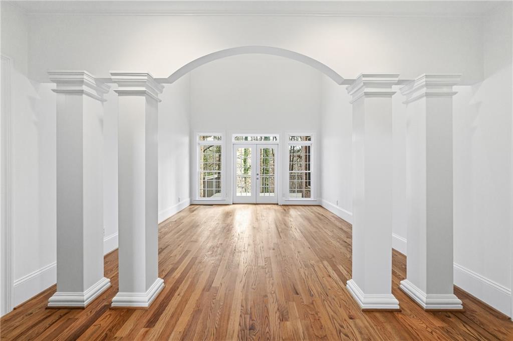 125 River N Circle Sandy Springs, GA 30328 - Photo 39 of 96 a view of an empty room with wooden floor and a window
