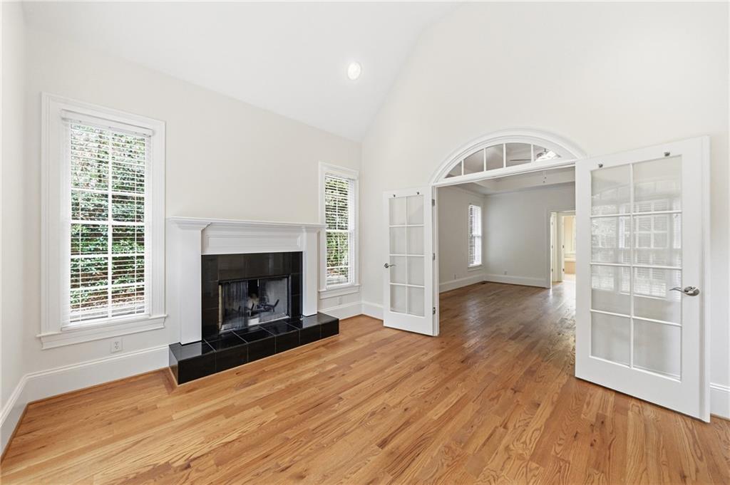 125 River N Circle Sandy Springs, GA 30328 - Photo 44 of 96 a view of an empty room with wooden floor fire place and a window