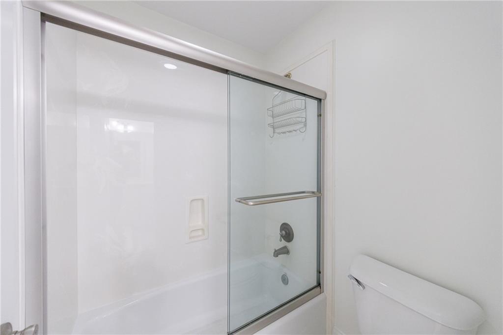 125 River N Circle Sandy Springs, GA 30328 - Photo 66 of 96 a bathroom with a shower and a mirror