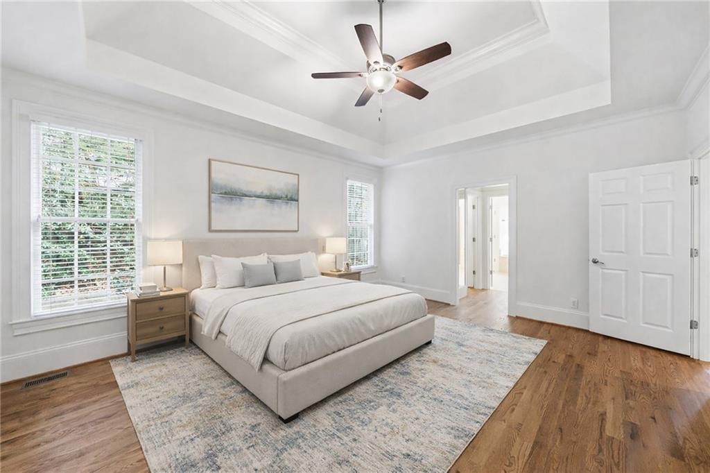 125 River N Circle Sandy Springs, GA 30328 - Photo 7 of 96 a spacious bedroom with a large bed chandelier and a window