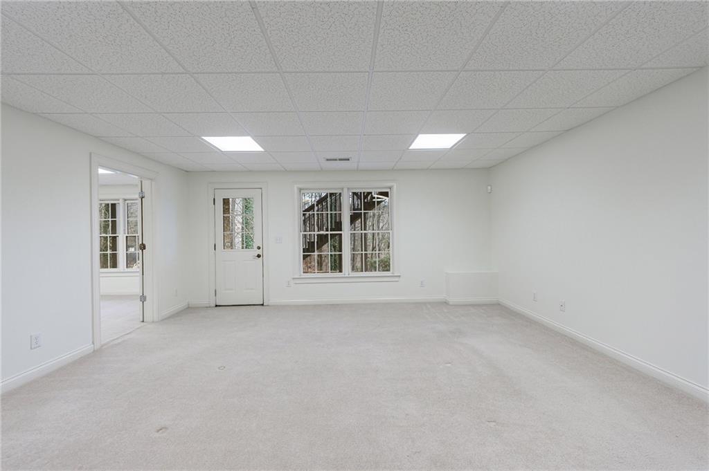 125 River N Circle Sandy Springs, GA 30328 - Photo 77 of 96 a view of an empty room with a window
