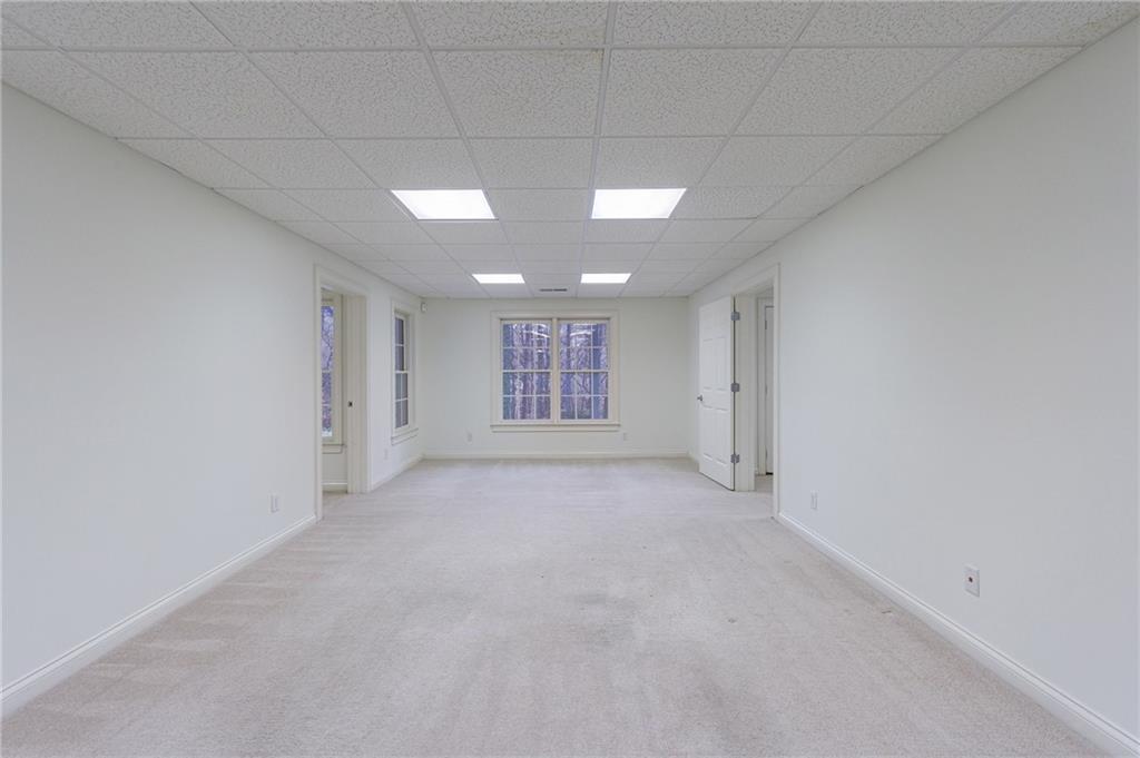 125 River N Circle Sandy Springs, GA 30328 - Photo 79 of 96 a view of an empty room with a window