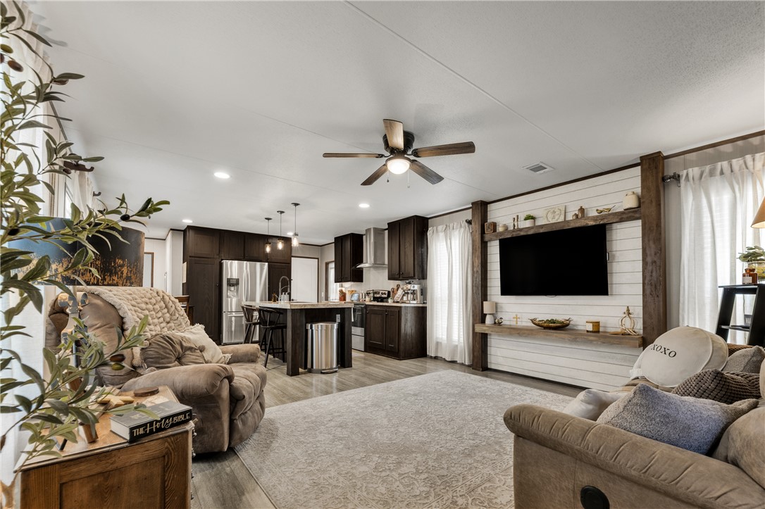 3133 Henderson Road Navasota, TX 77868 - Photo 14 of 26 a living room with furniture and a flat screen tv