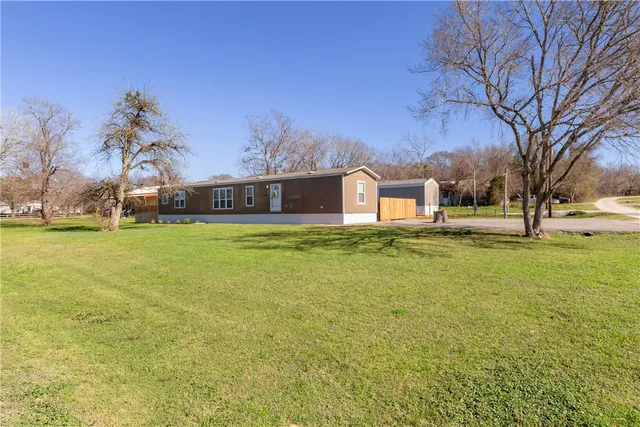 a view of a swimming pool with an outdoor space and seating area