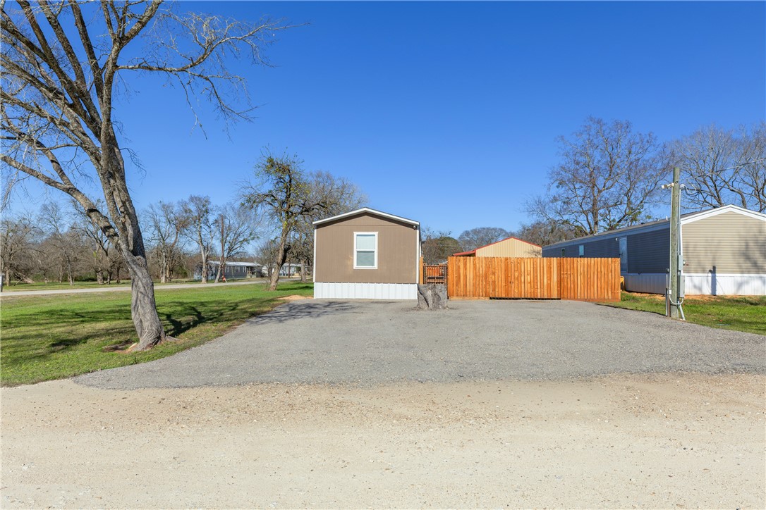 3133 Henderson Road Navasota, TX 77868 - Photo 5 of 26 a front view of a house with a yard and garage
