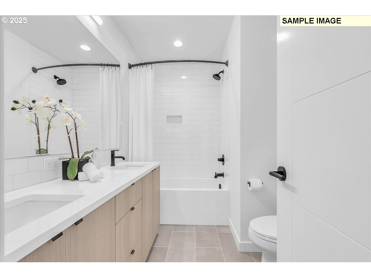 3674 Southeast Haig Street Portland, OR 97202 - Photo 16 of 20 a bathroom with a sink a toilet and shower