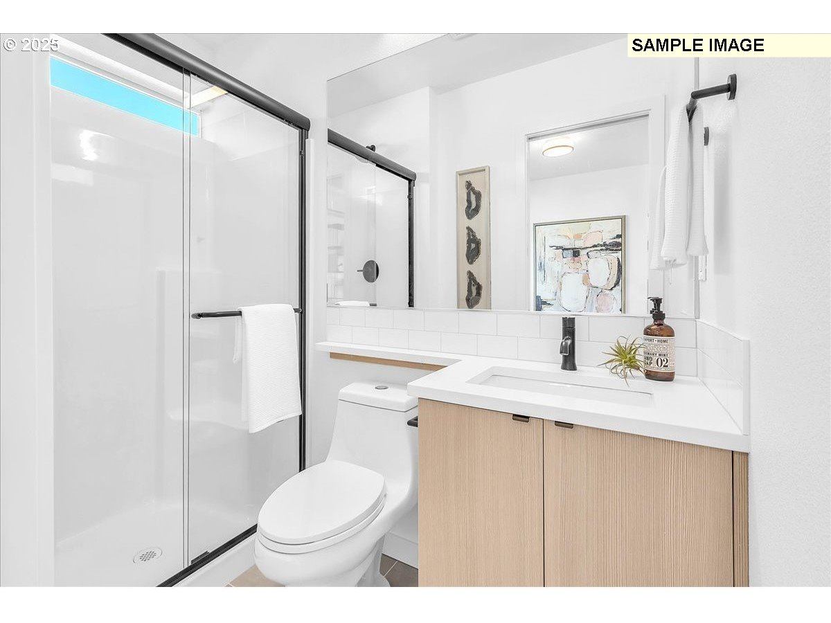 3674 Southeast Haig Street Portland, OR 97202 - Photo 19 of 20 a bathroom with a sink toilet and shower