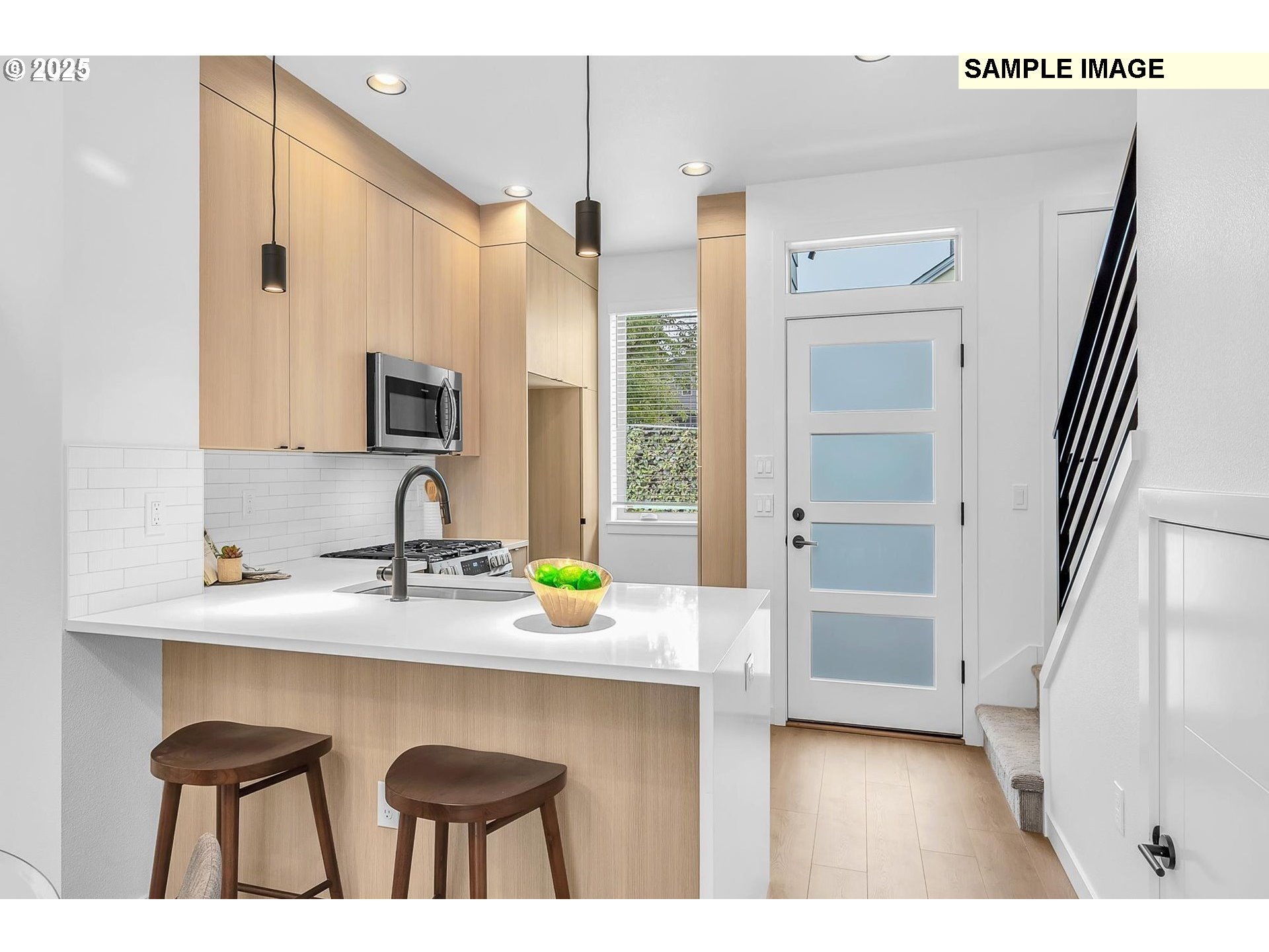 3674 Southeast Haig Street Portland, OR 97202 - Photo 2 of 20 a kitchen with a sink cabinets and wooden floor