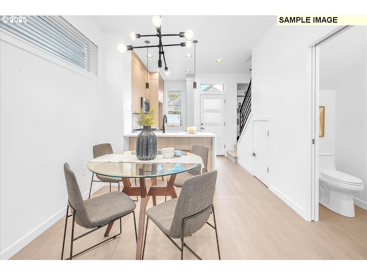 3674 Southeast Haig Street Portland, OR 97202 - Photo 6 of 20 a view of a dining room with furniture and wooden floor