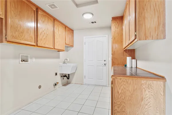a view of kitchen with cabinets