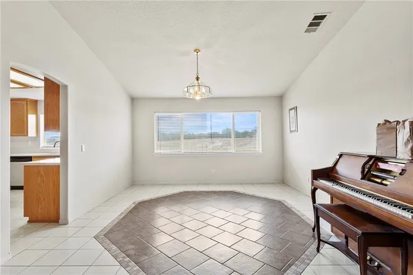 a view of room with furniture window and wooden floor