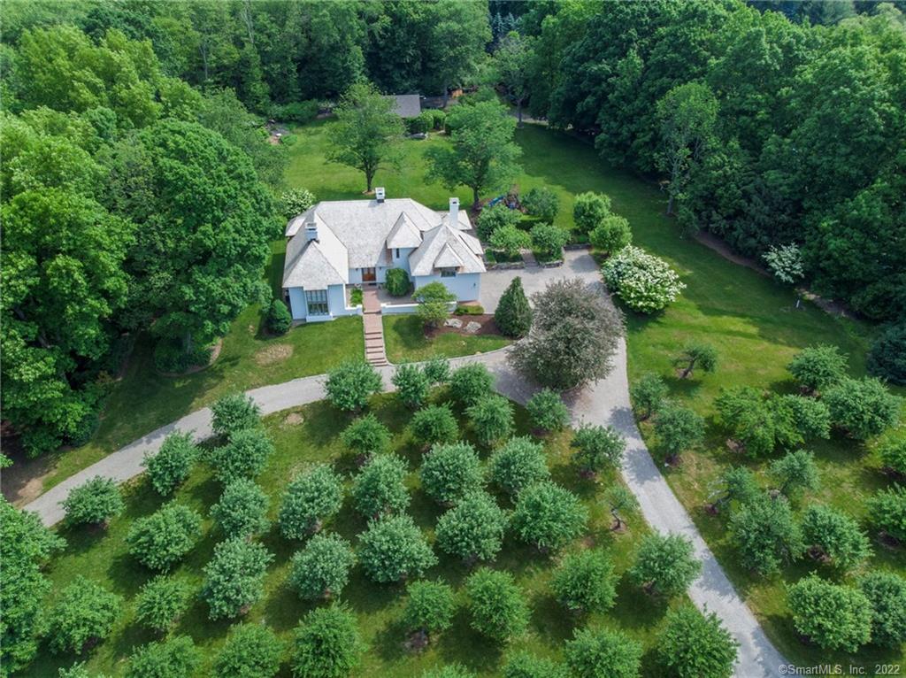 89 Middlebrook Farm Road Wilton, CT 06897 - Photo 1 of 1 an aerial view of a house with pool