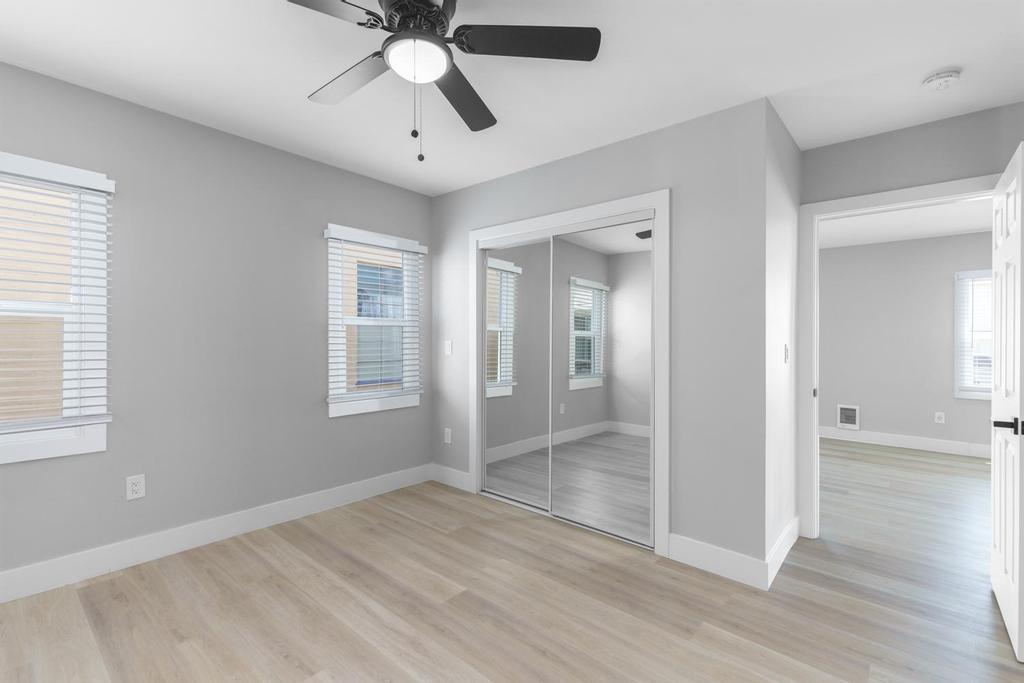 128 Bristol Boulevard San Leandro, CA 94577 - Photo 16 of 32 a view of empty room with wooden floor and fan