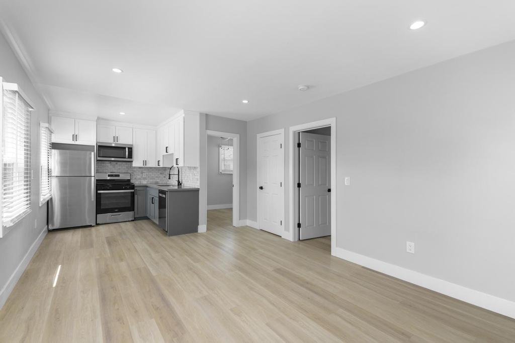 128 Bristol Boulevard San Leandro, CA 94577 - Photo 19 of 32 a kitchen with stainless steel appliances a refrigerator and a stove top oven