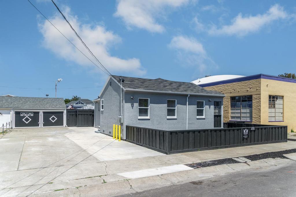 128 Bristol Boulevard San Leandro, CA 94577 - Photo 7 of 32 a view of a house with a wooden fence